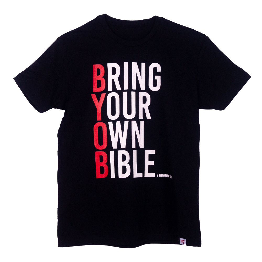 Black t-shirt with the words Bring Your Own Bible written going down the front of the shirt.