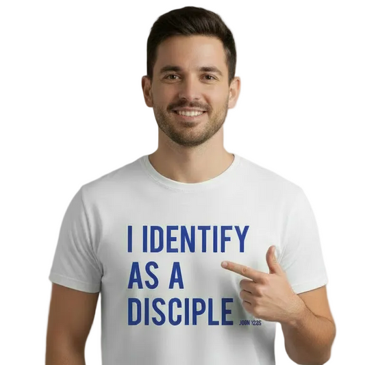 Man wearing a white t-shirt with 'I IDENTIFY AS A DISCIPLE' text, pointing to the text.