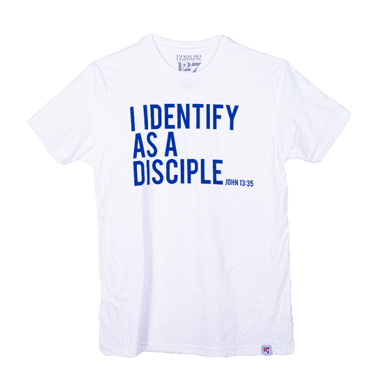 White shirt with blue writing saying I identify as a Disciple.
