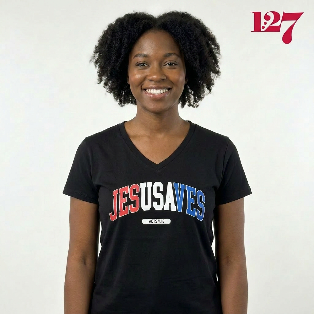 African American woman wearing a black v-neck t-shirt with the words "Jesusaves" across the front.