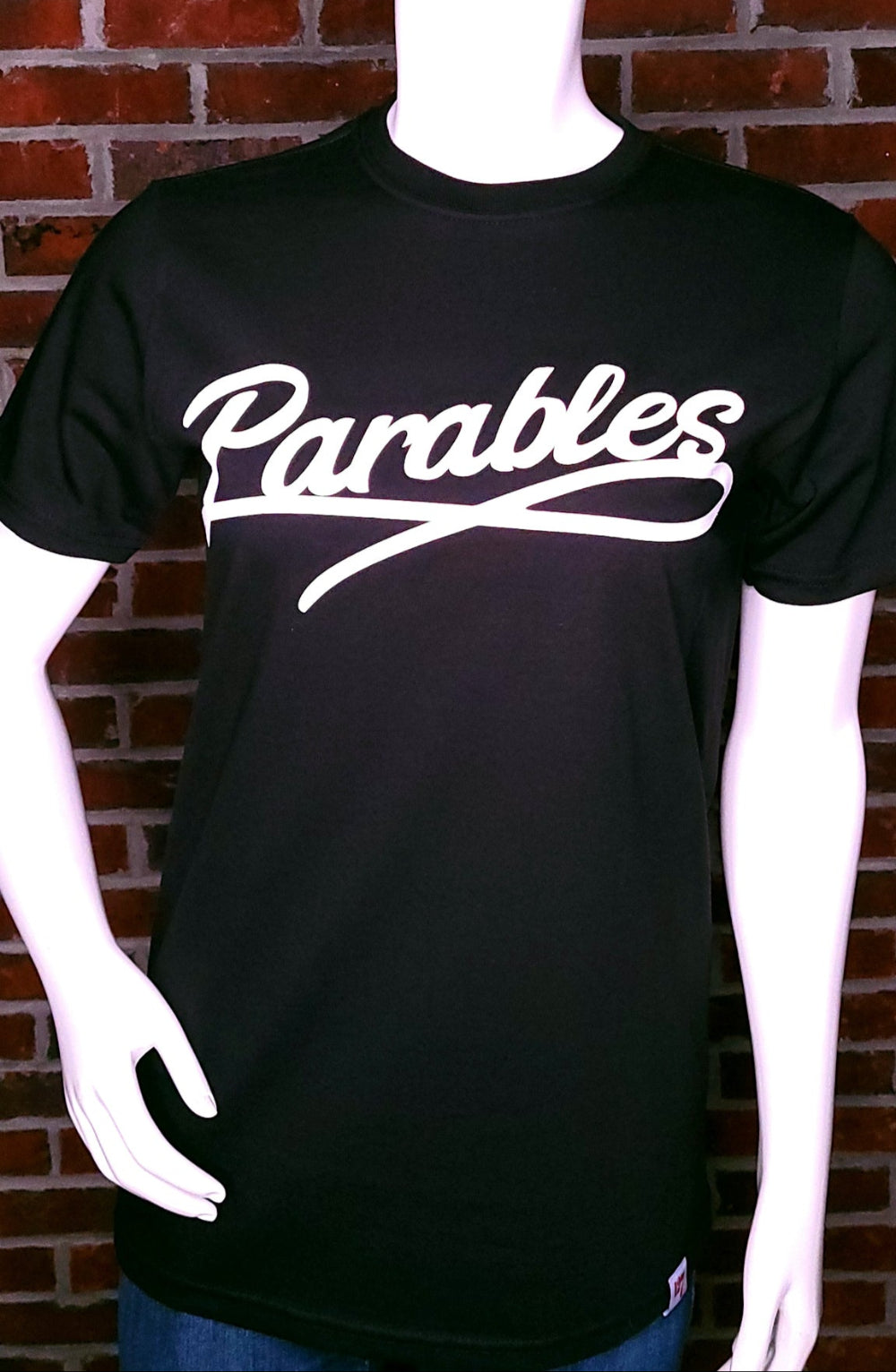 Black Shirt with the word Parables written in a script.