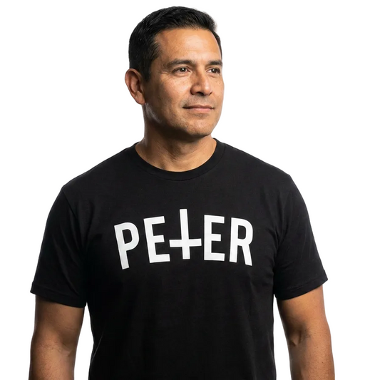 Man wearing a black t-shirt with 'PETER' printed on it against a white background