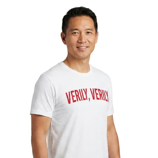 Man wearing a white t-shirt with 'VERILY, VERILY' text on a white background
