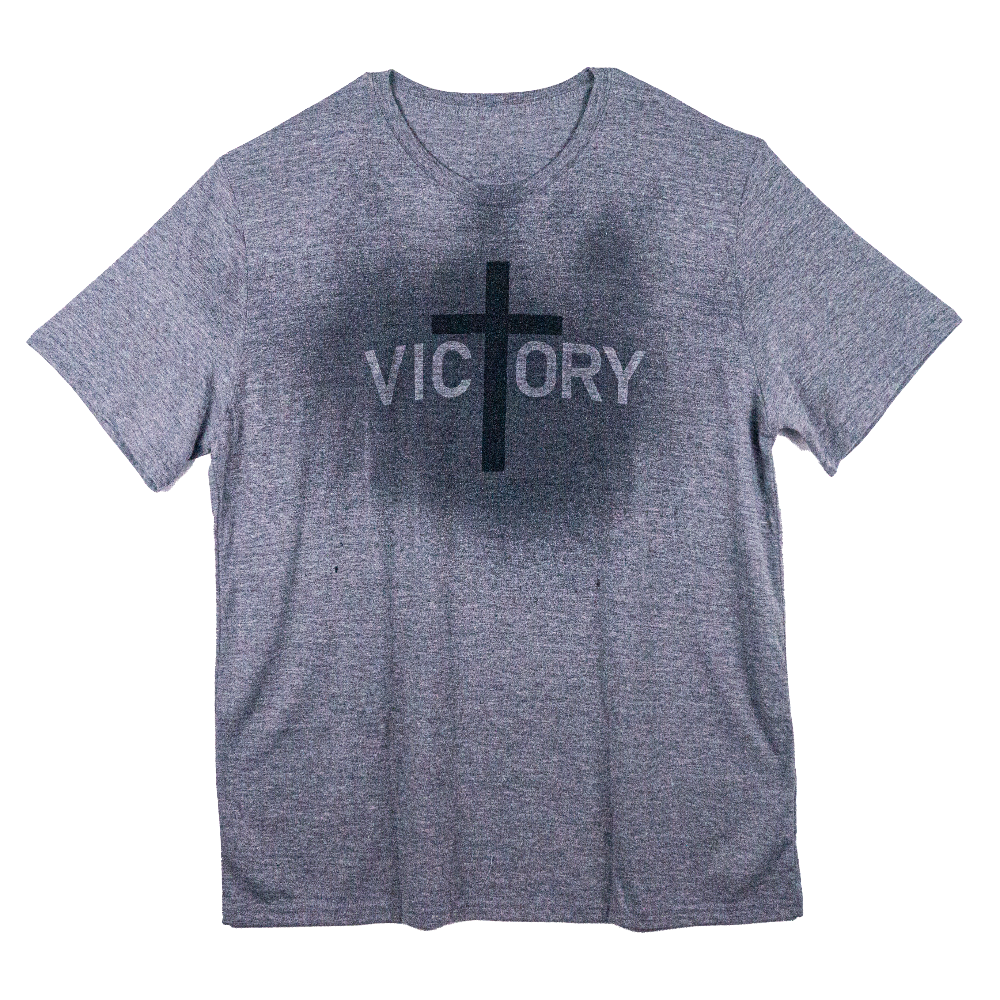 Gray t-shirt with a cross across the front that reveals the word Victory when it gets wet.