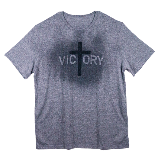 Gray t-shirt with a cross across the front that reveals the word Victory when it gets wet.