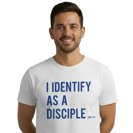 Man wearing a white t-shirt with 'I IDENTIFY AS A DISCIPLE' text on a gray background