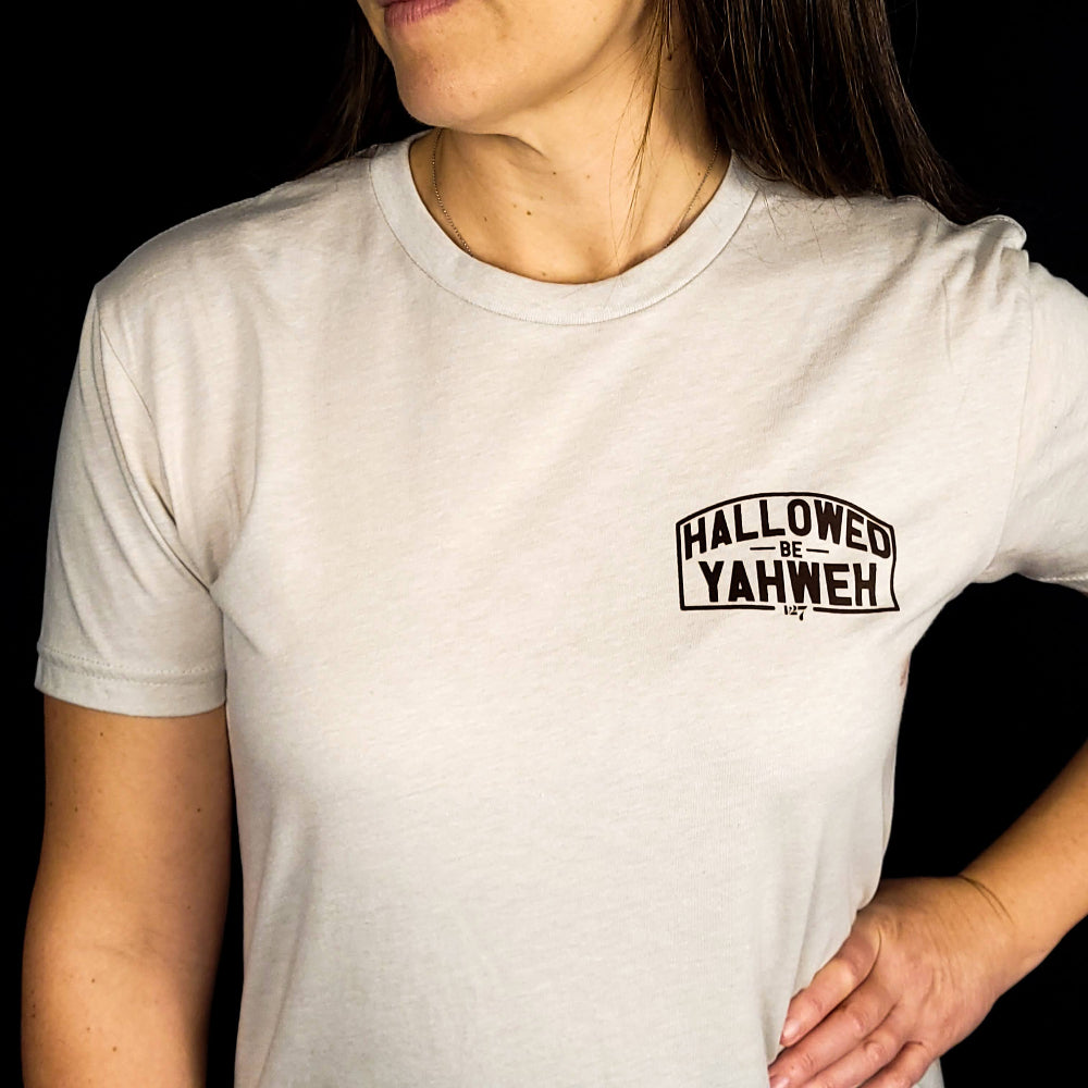 Sand Colored t-shirt with front design the says Hallowed Be Yahweh, full back design says Hallowed be Yahweh.