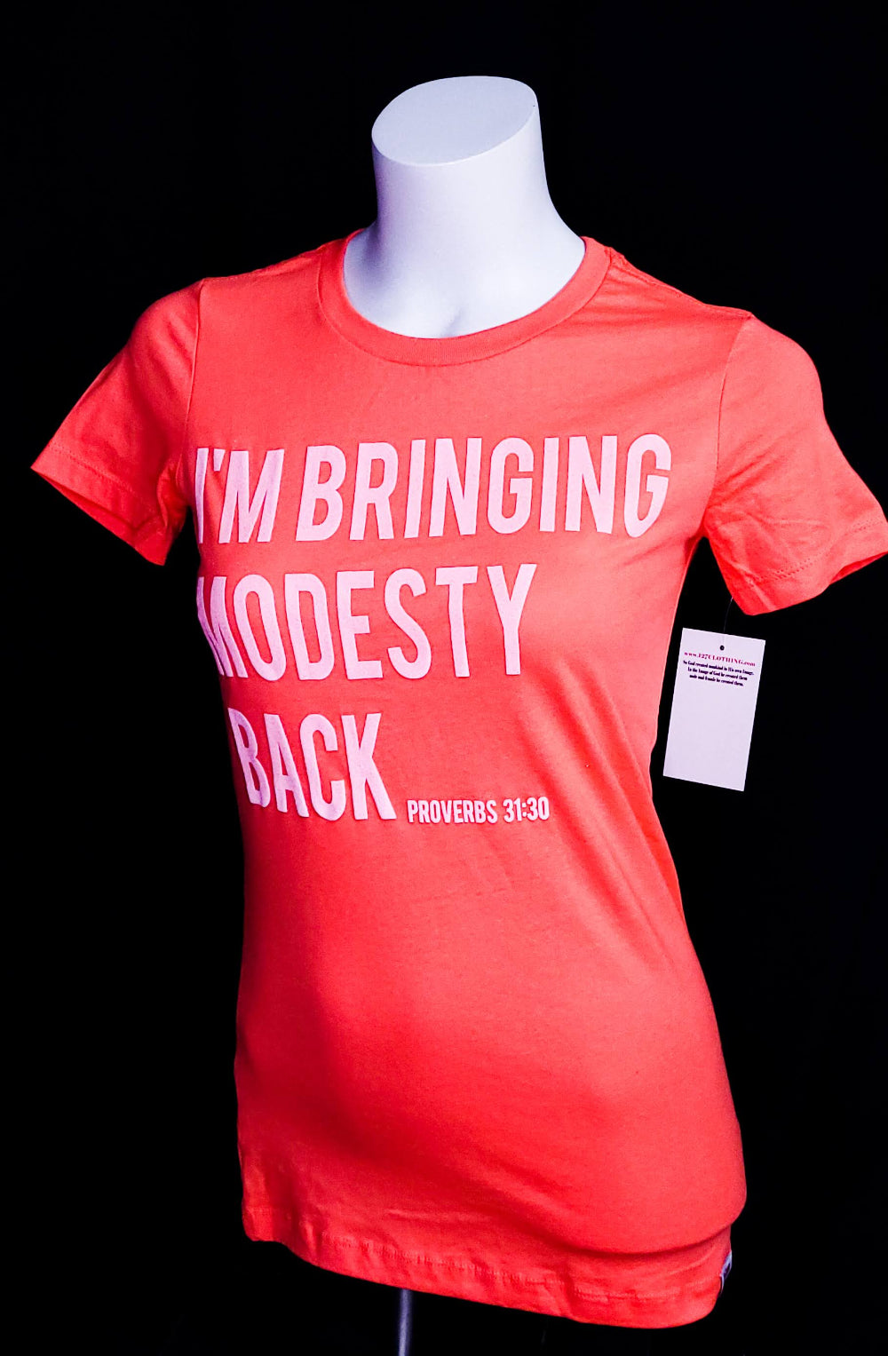 Women's t-shirt with the words I'm bringing Modesty back across the front.