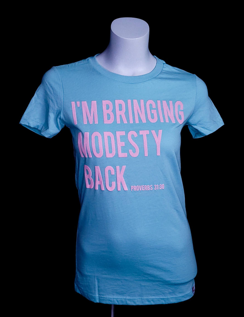 Women's t-shirt with the words I'm bringing Modesty back across the front.
