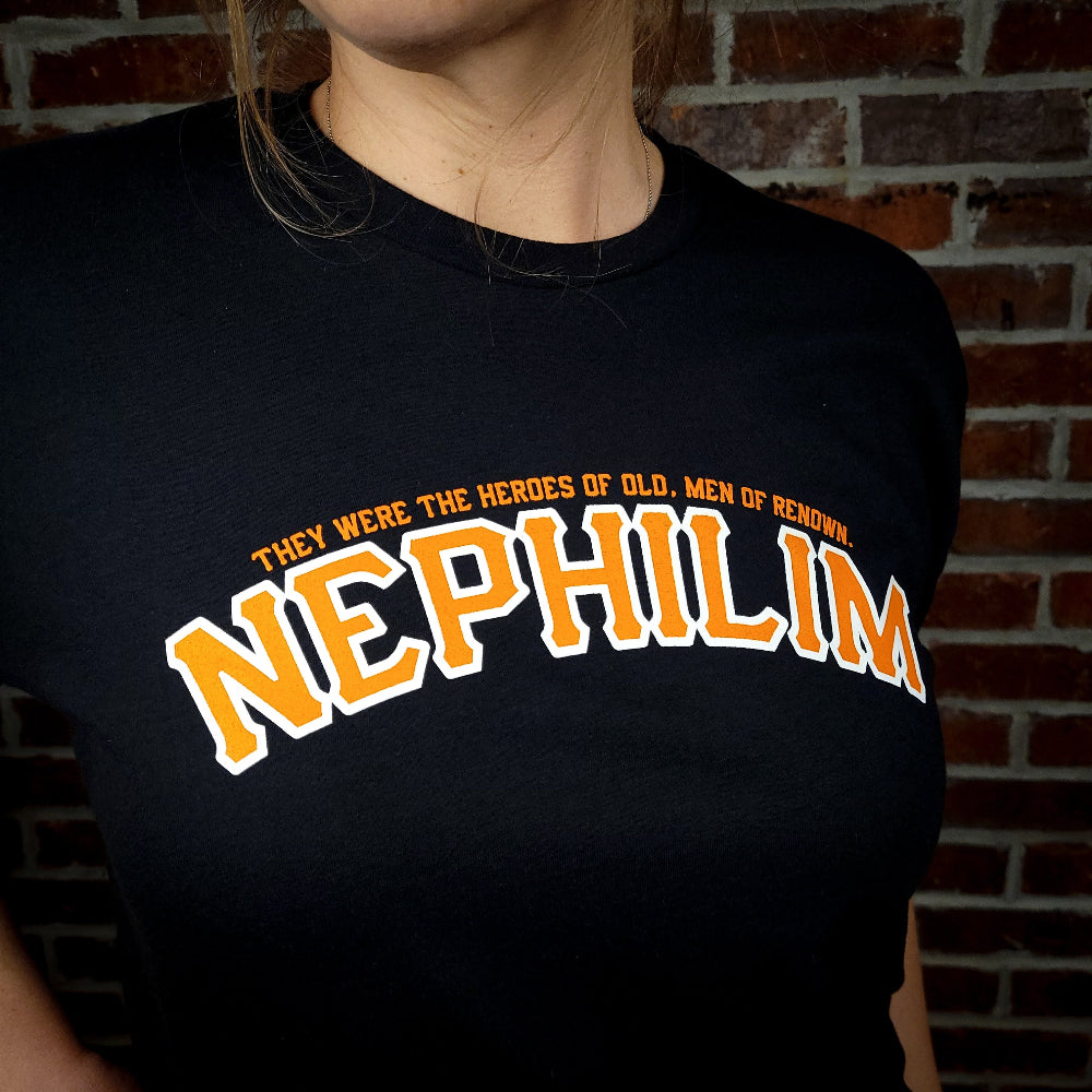 Black Shirt with the Word Nephilim written across the chest with orange ink. Inspired by the San Fransisco Giants logo.