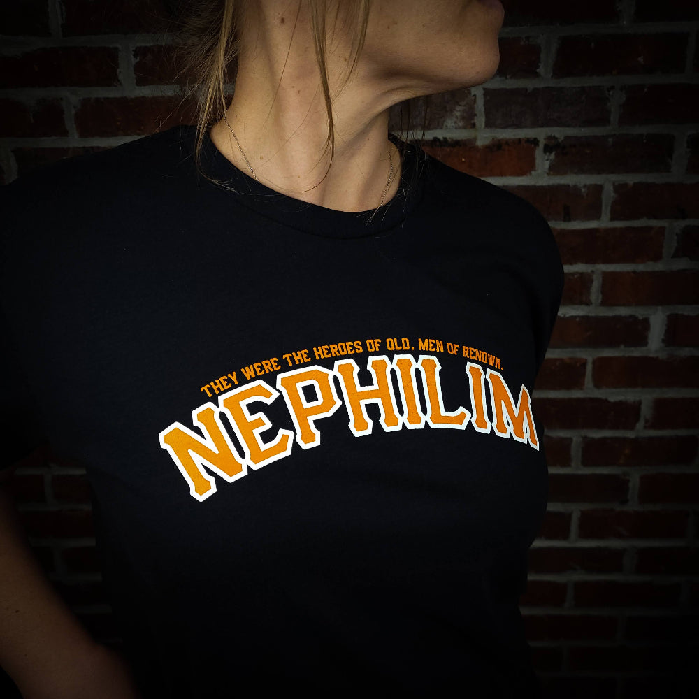 Black Shirt with the Word Nephilim written across the chest with orange ink. Inspired by the San Fransisco Giants logo.