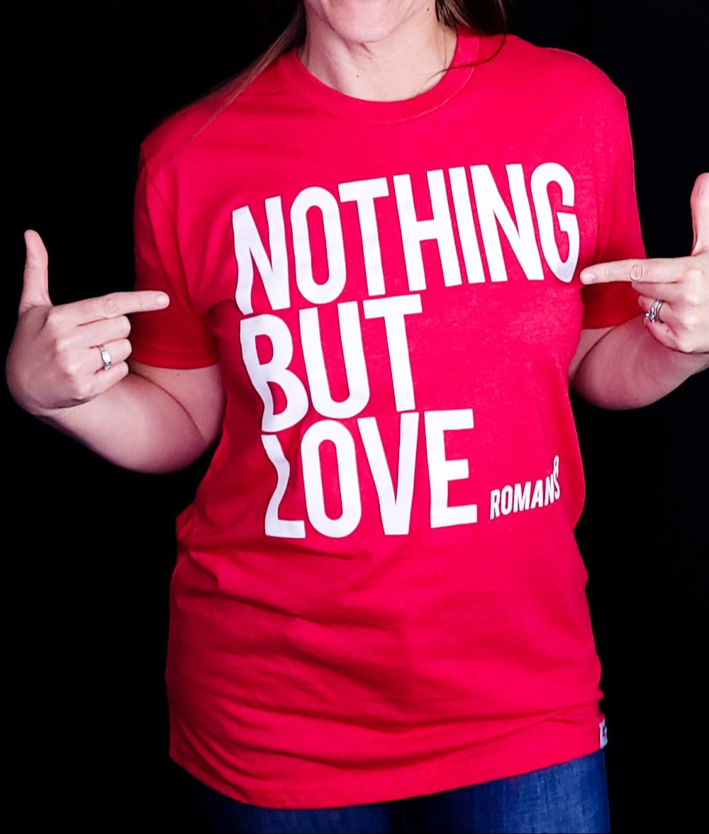 Red shirt with the words Nothing But Love on the front in white writing.