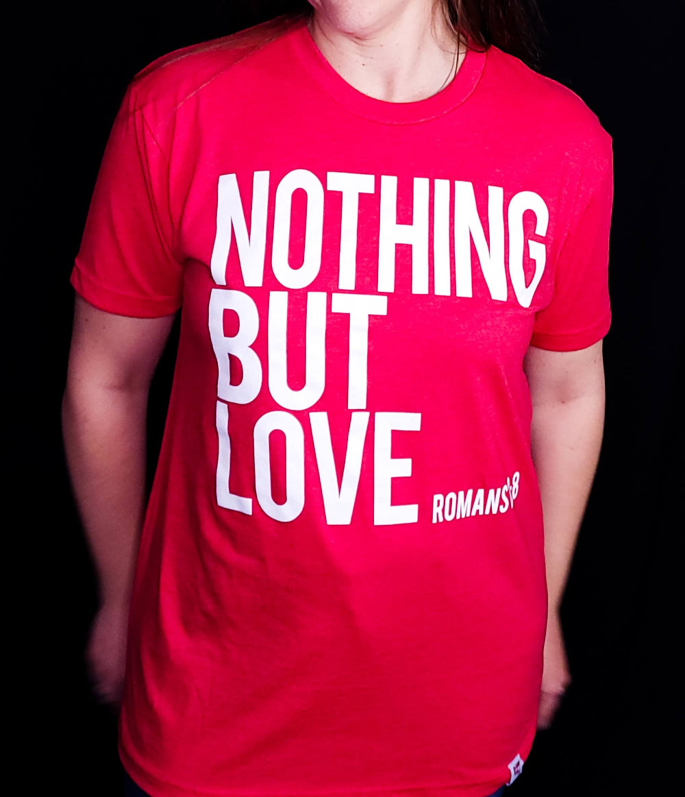 Red shirt with the words Nothing But Love on the front in white writing.