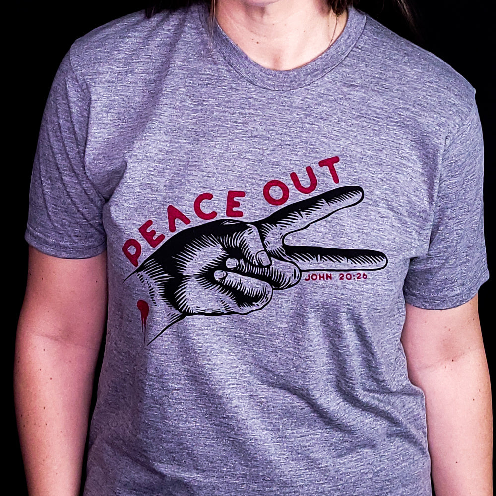 Gray shirt with the words Peace Out over two fingers making the peace sign. Referencing the verse John 20:26