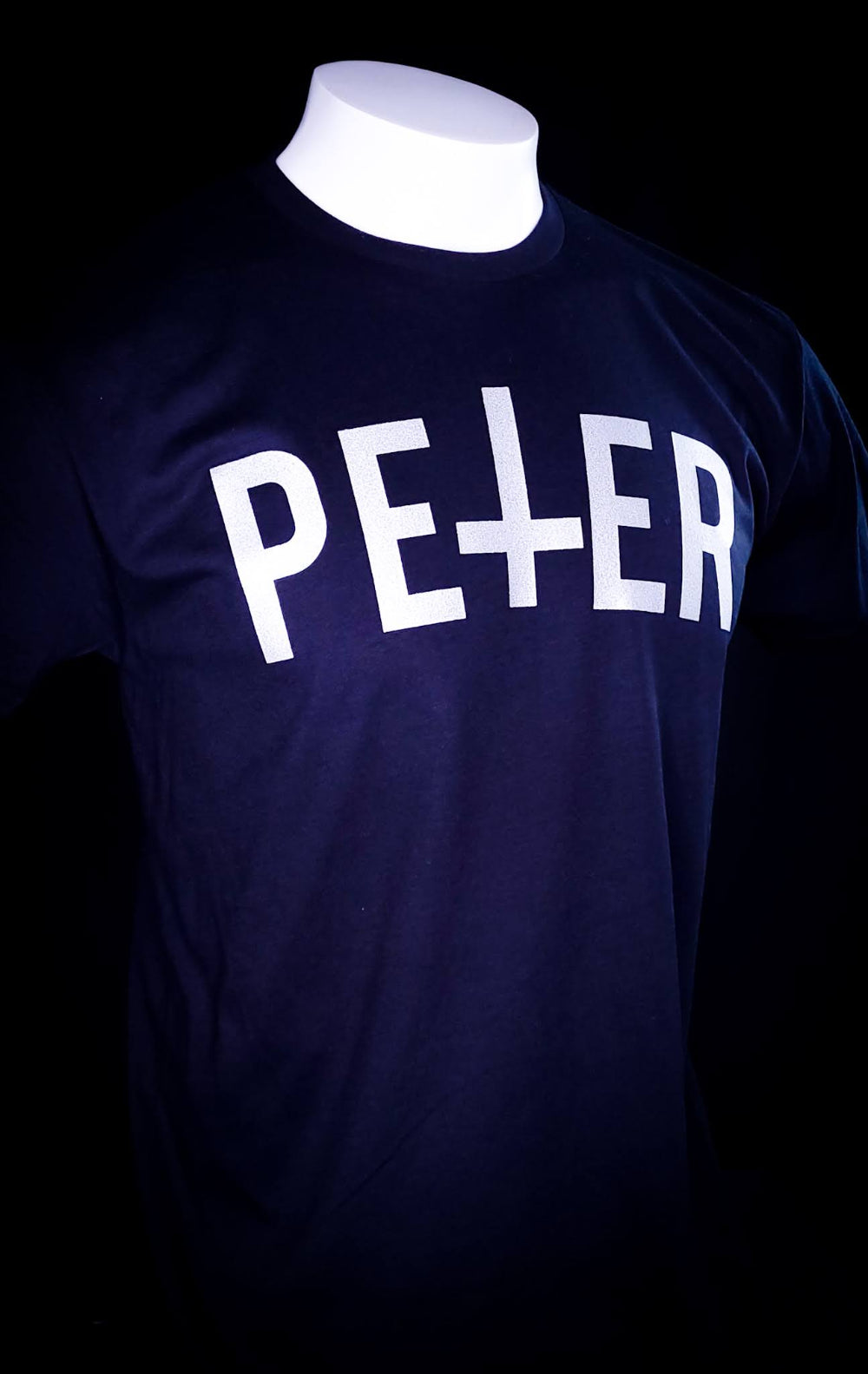 Black Shirt with a Petrine Cross on the front in the name of Saint Peter.