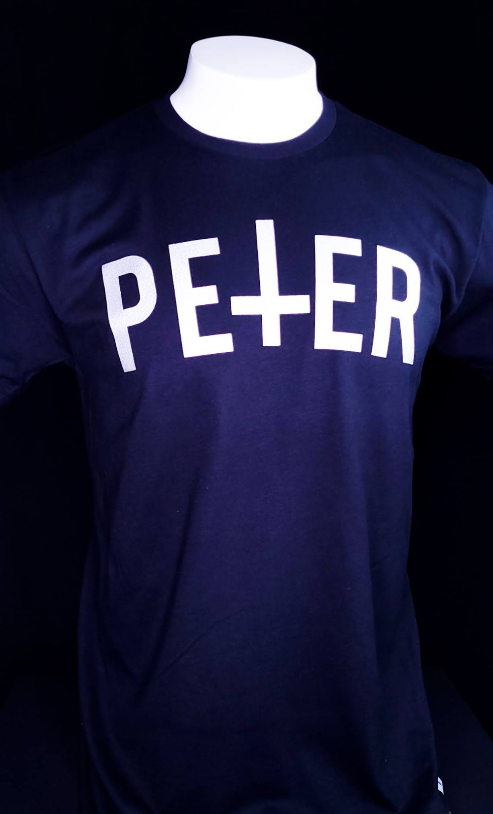 Black Shirt with a Petrine Cross on the front in the name of Saint Peter.