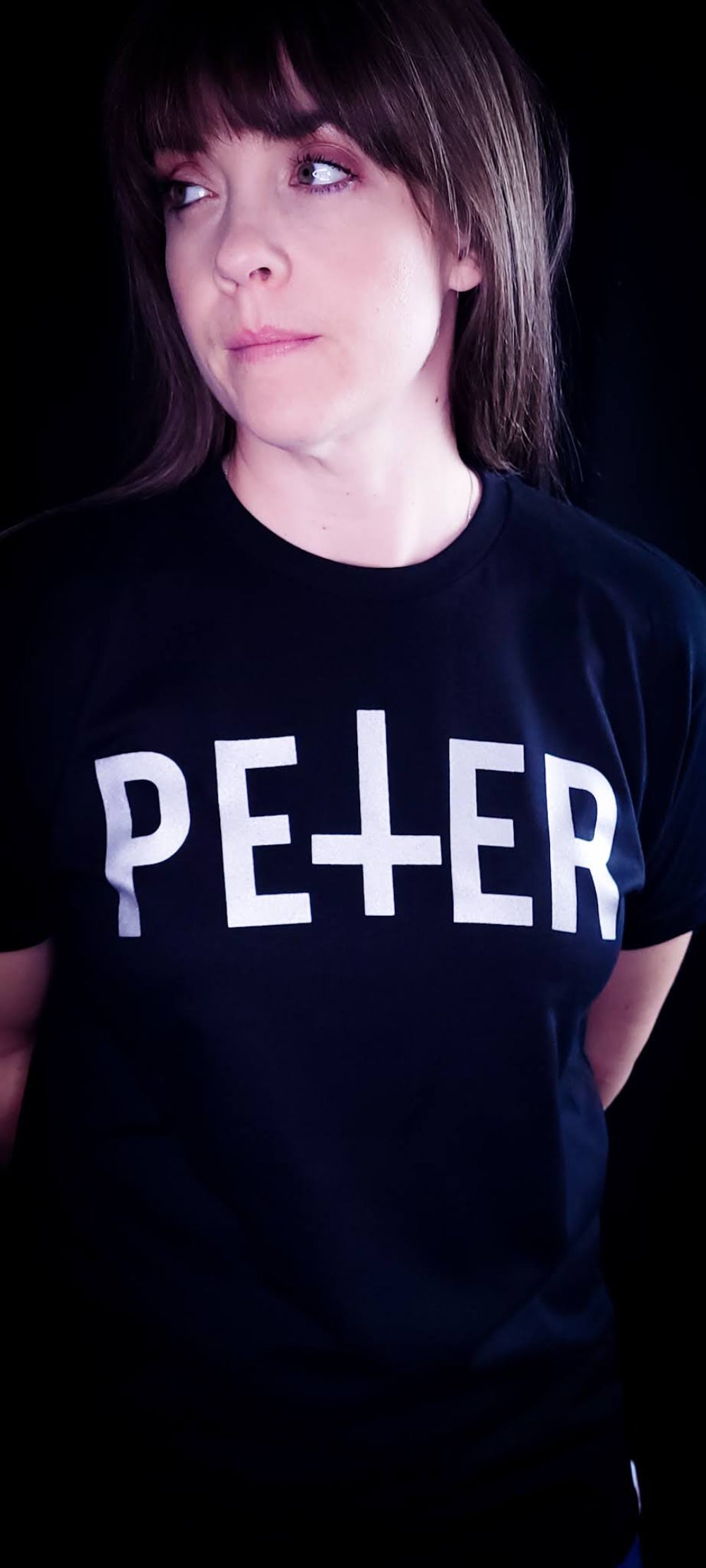 Black Shirt with a Petrine Cross on the front in the name of Saint Peter.