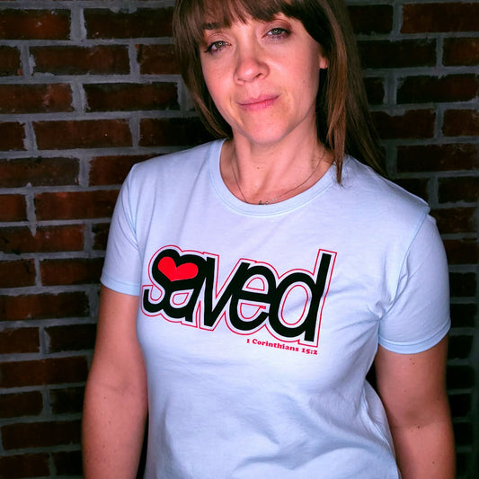 Light Blue t-shirt with the word Saved written along with a heart in the void of SA.