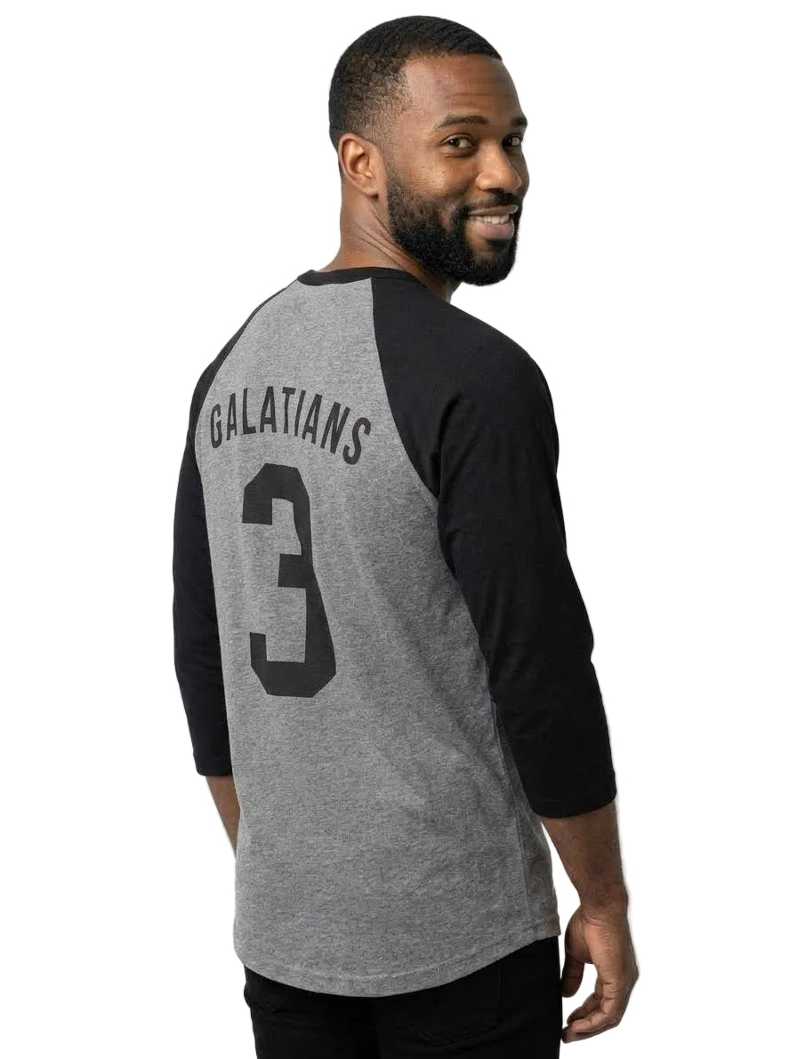 A man wearing a heather gray and black baseball t-shirt with 'GALATIANS' and the number '3' printed on the back, shown from a three-quarter back view against a light gray background.