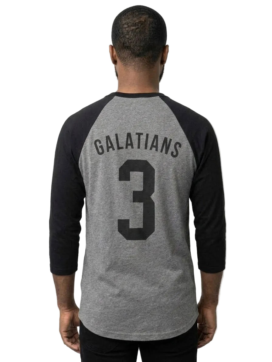 A man viewed from behind wearing a heather gray and black raglan baseball t-shirt with 'GALATIANS' and the number '3' printed on the back.