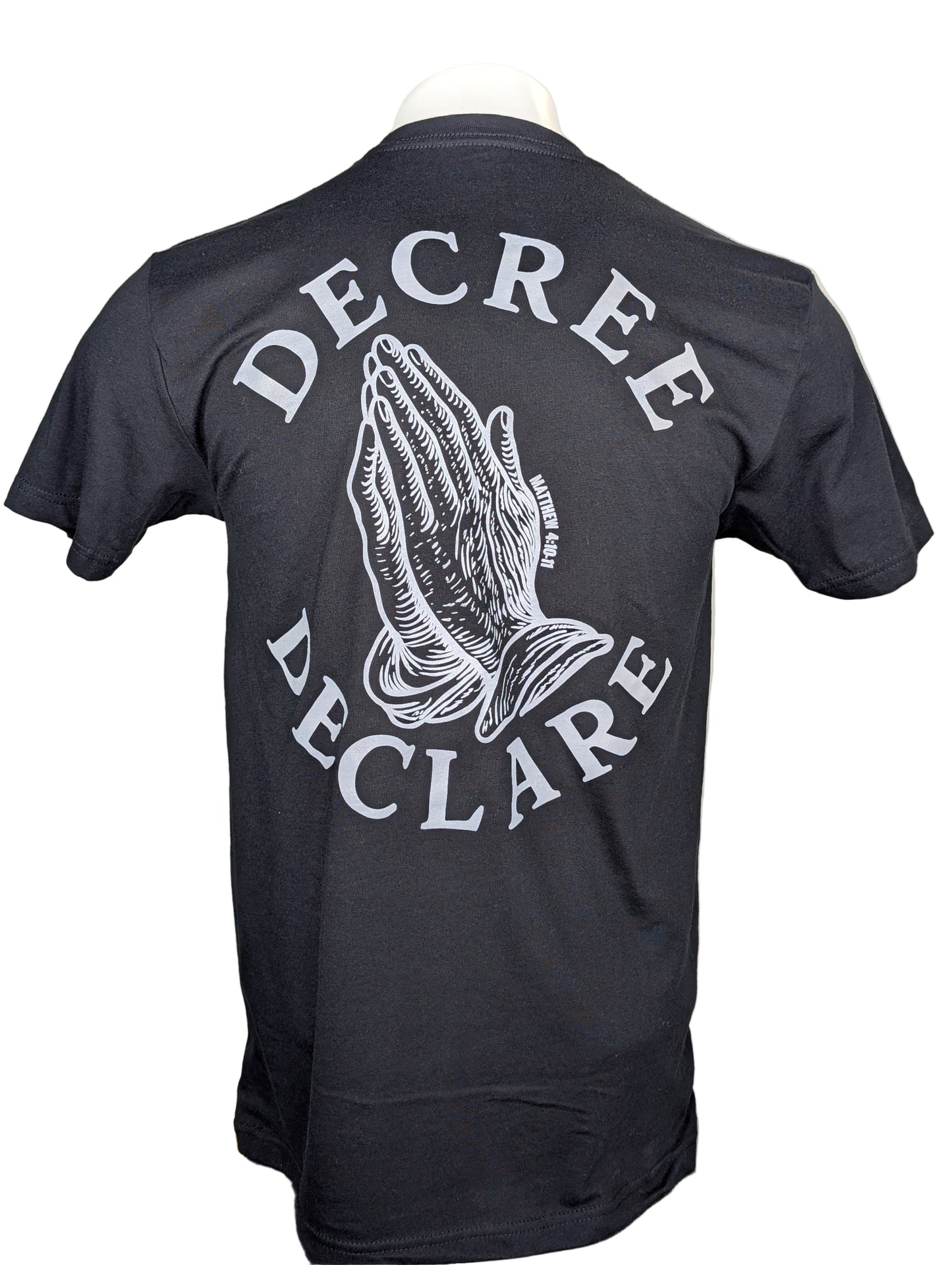 Black t-shirt with 'Decree Declare' text and praying hands design on a white background