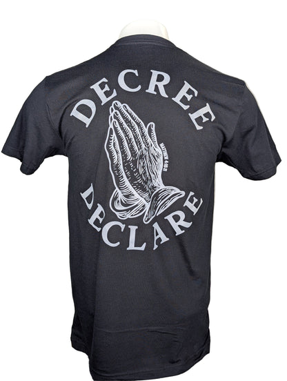 Black t-shirt with 'Decree Declare' text and praying hands design on a white background