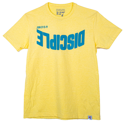 Yellow shirt with the Word Disciple upside down on it. The verse is pointing to John 21:15-19.