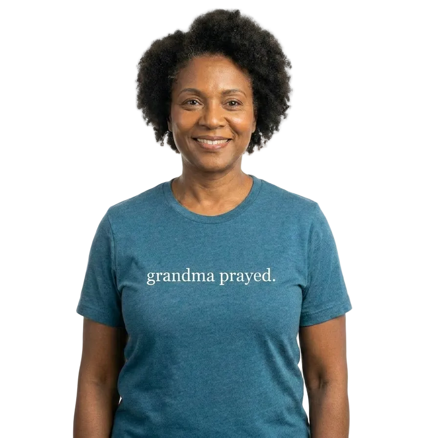 Person wearing a blue t-shirt with 'grandma prayed' text on a white background