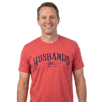 Man wearing a red t-shirt with 'HUSBANDS GRILL' text on a white background