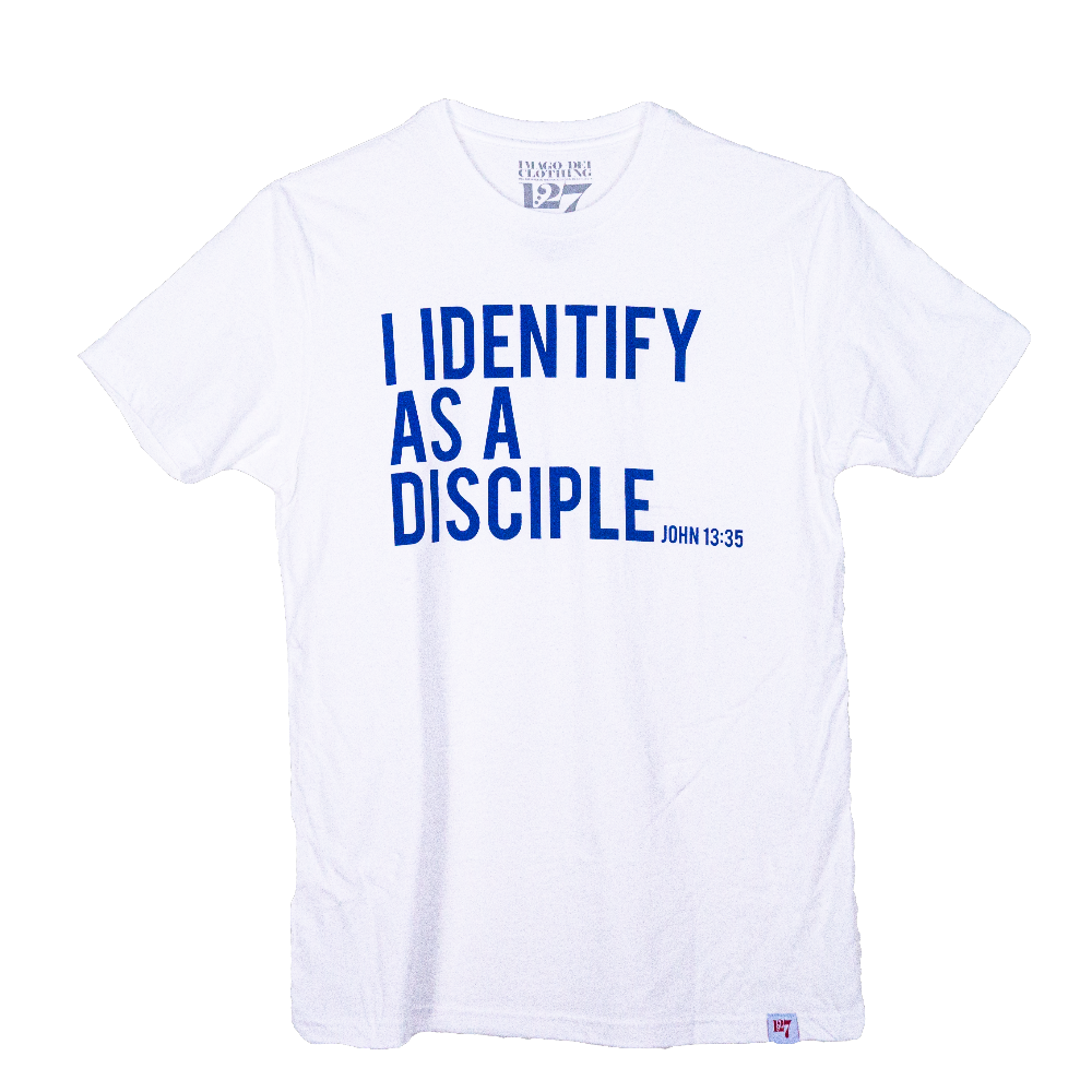 White shirt with blue writing saying I identify as a Disciple. 