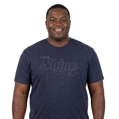 Man wearing a navy blue t-shirt with text on a white background