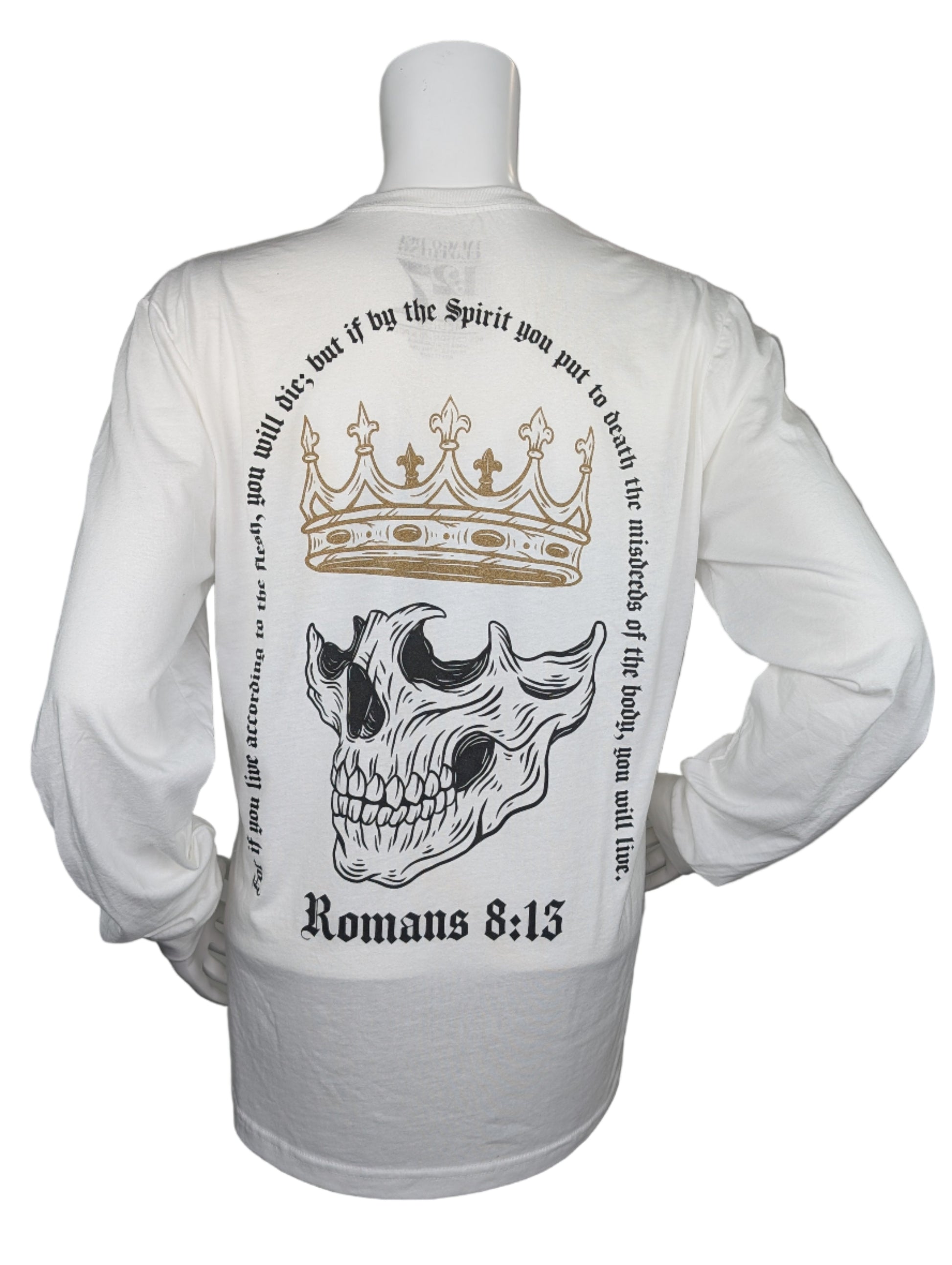White long-sleeve shirt with a skull design and text on a mannequin against a gray background