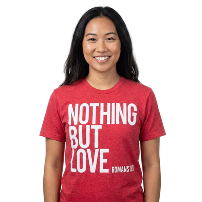 Person wearing a red t-shirt with 'NOTHING BUT LOVE' text on a white background