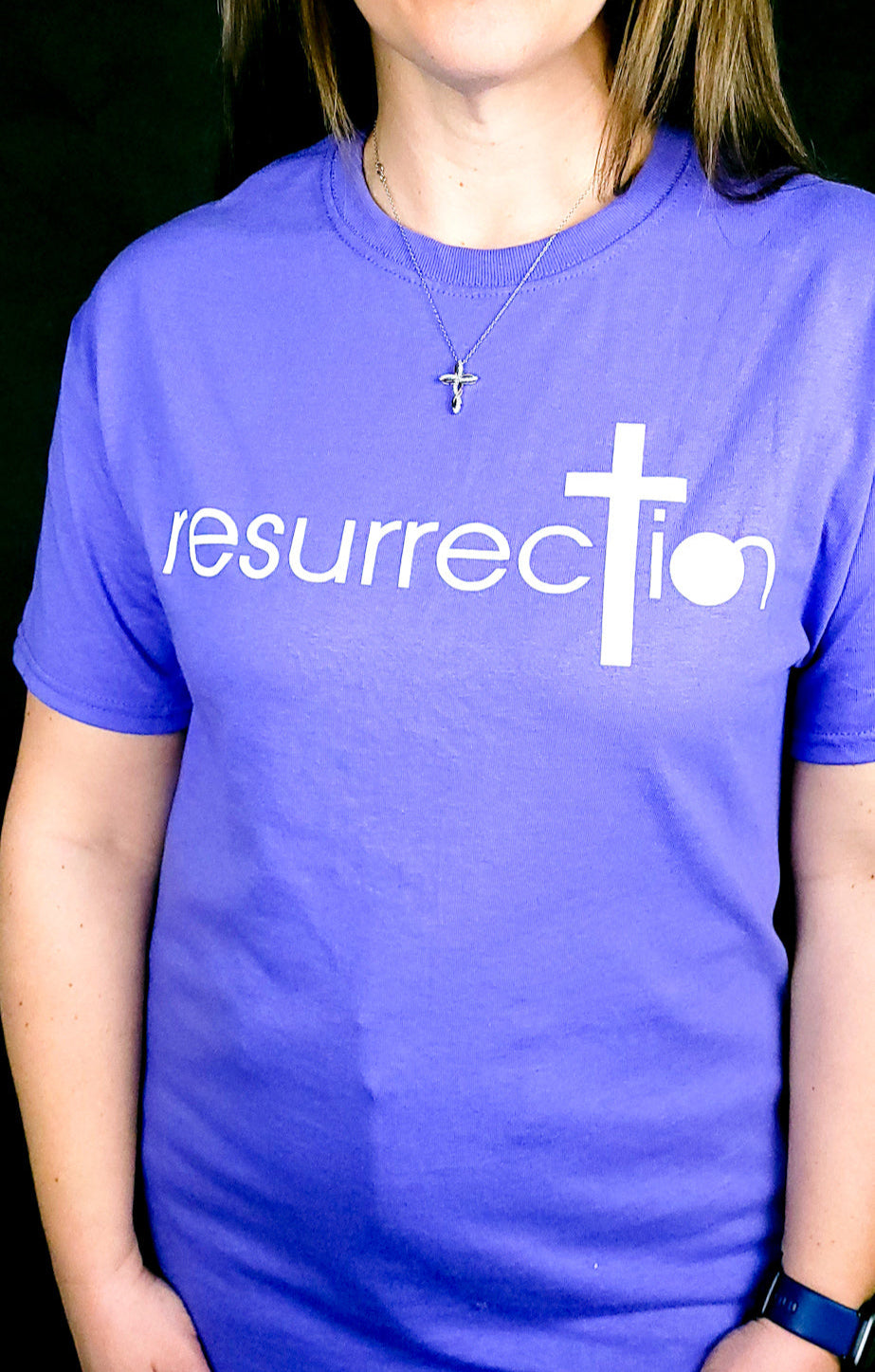 Purple T-shirt with the word Resurrection written across the chest. 