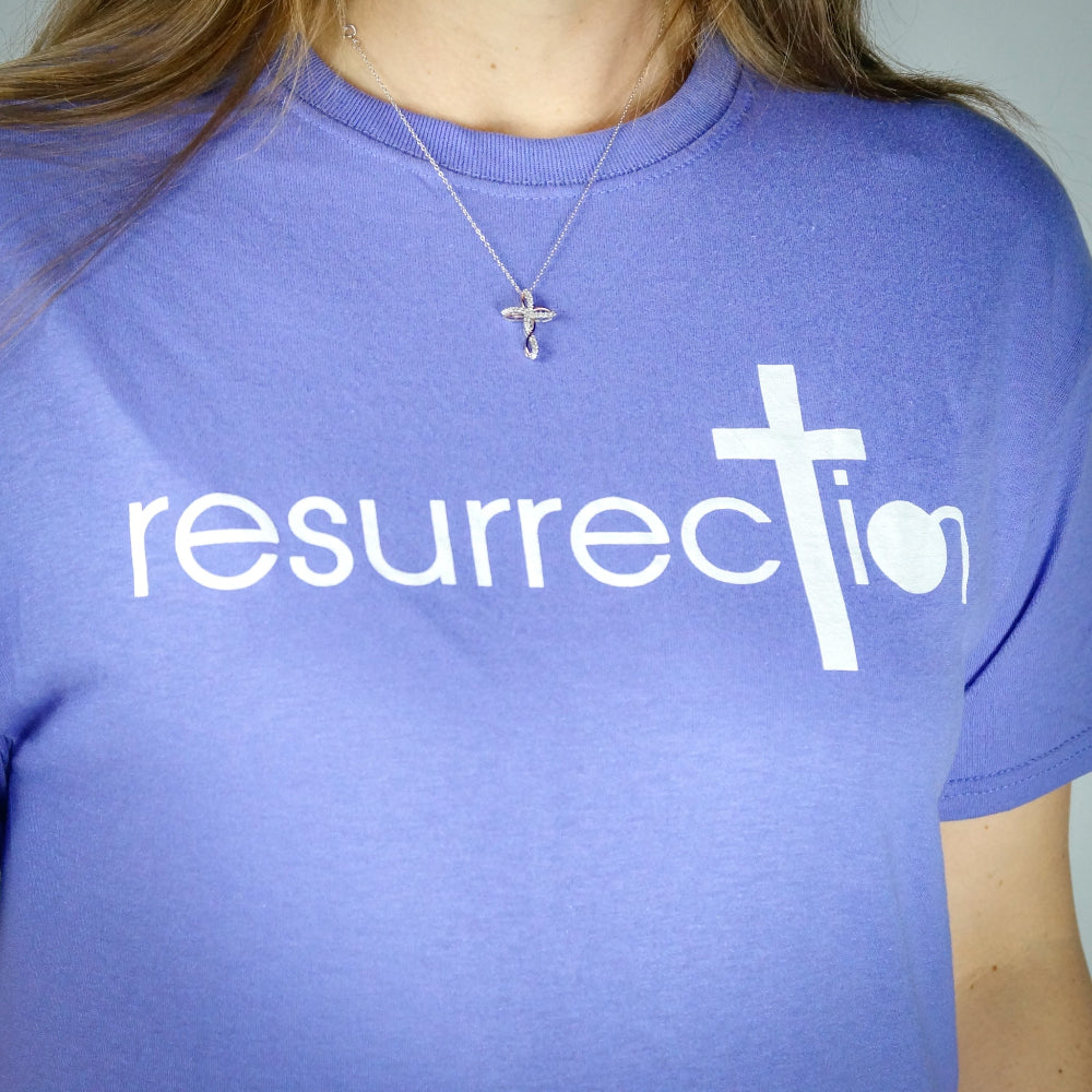 Purple T-shirt with the word Resurrection written across the chest. 