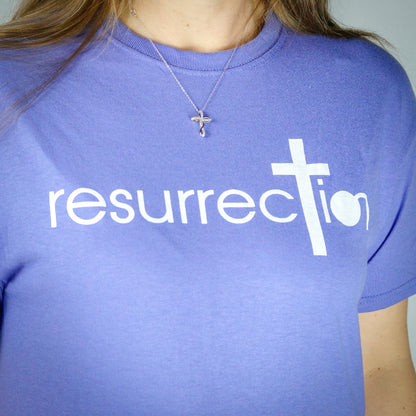 Purple T-shirt with the word Resurrection written across the chest. 