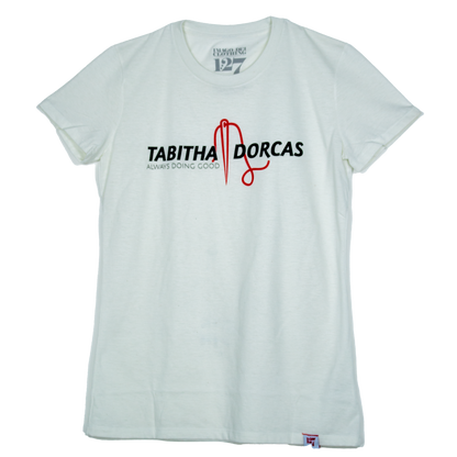 White shirt with black and red writing pointing to a bible figure named Tabitha Dorcas.