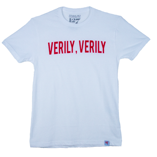 White shirt with the words Verily Verily on the front pointing to words that Jesus said in the King James Version of the Bible. 