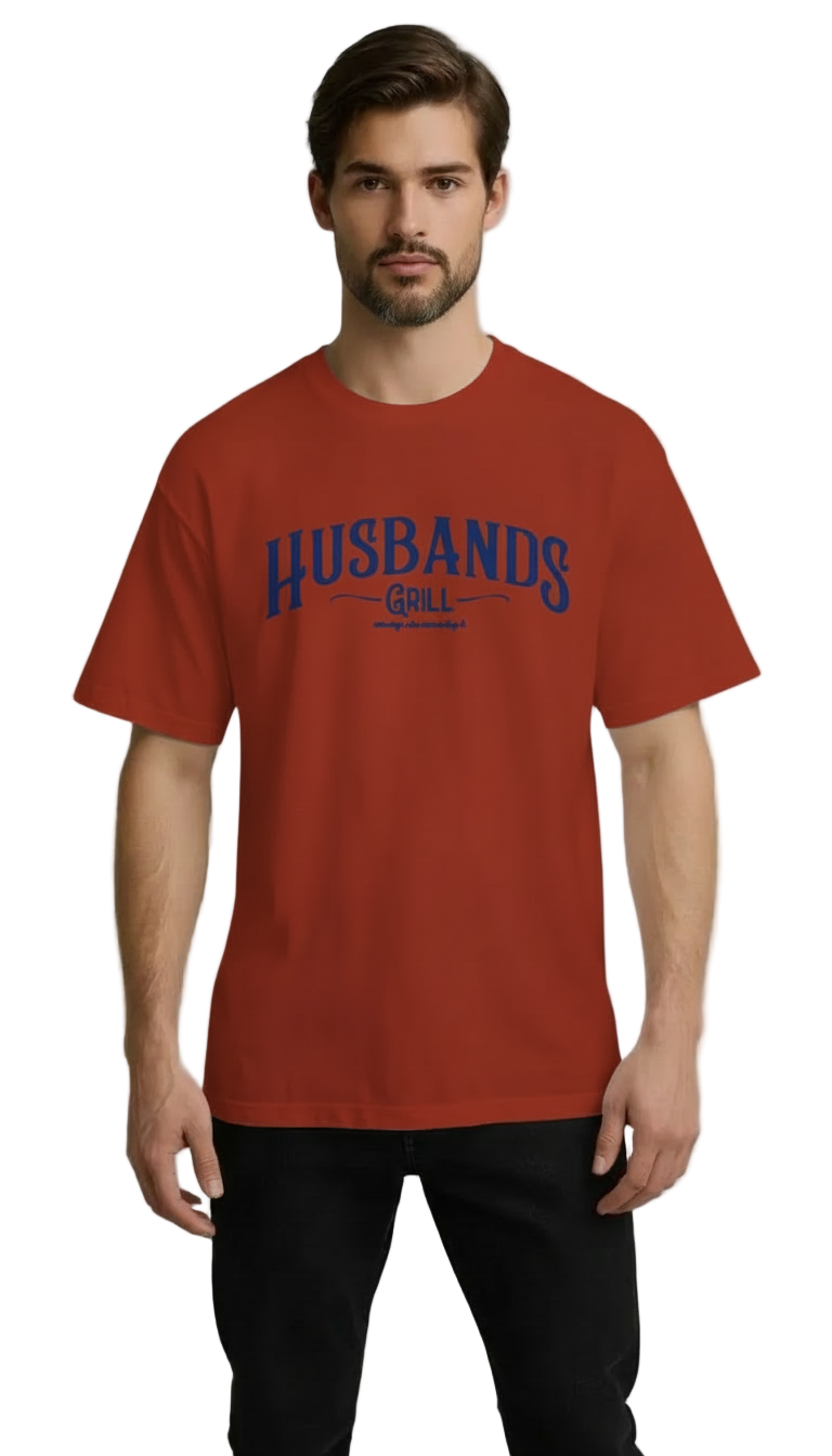 Man wearing a red t-shirt with 'HUSBANDS' printed on it against a gray background