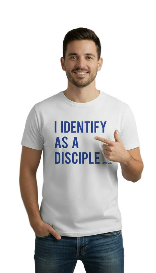 Man wearing a white t-shirt with 'I IDENTIFY AS A DISCIPLE' text, pointing to the text.