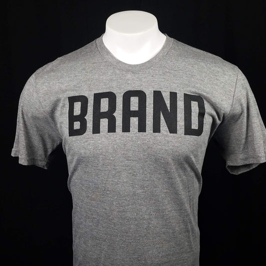 Gray t-shirt with the word brand  across the front that reveals the word New when it gets wet. 