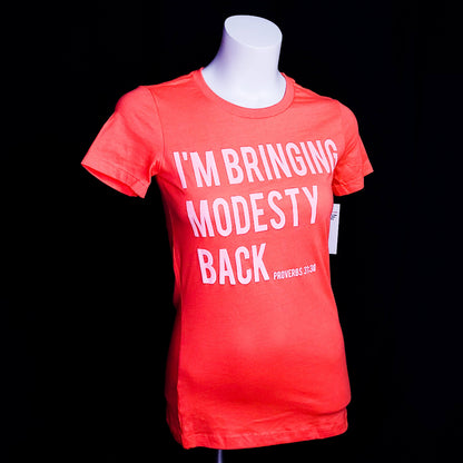 Women's t-shirt with the words I'm bringing Modesty back across the front.