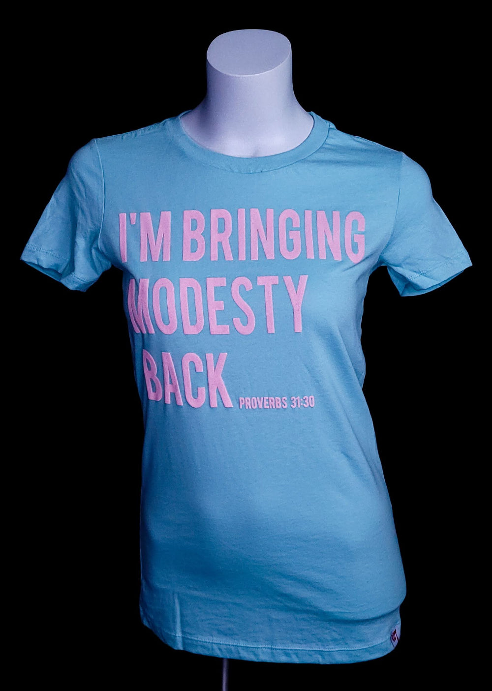 Women's t-shirt with the words I'm bringing Modesty back across the front.