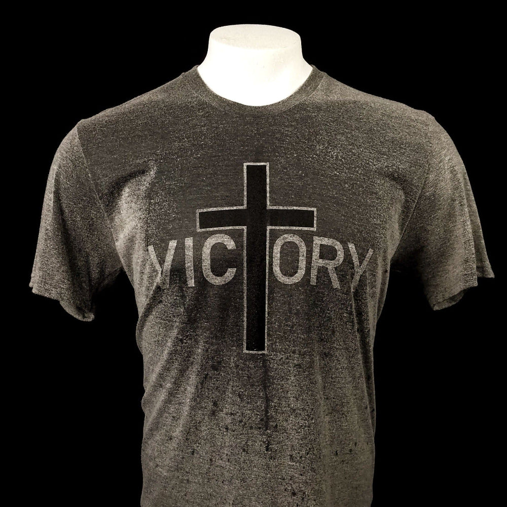 Gray t-shirt with a cross across the front that reveals the word Victory when it gets wet. 